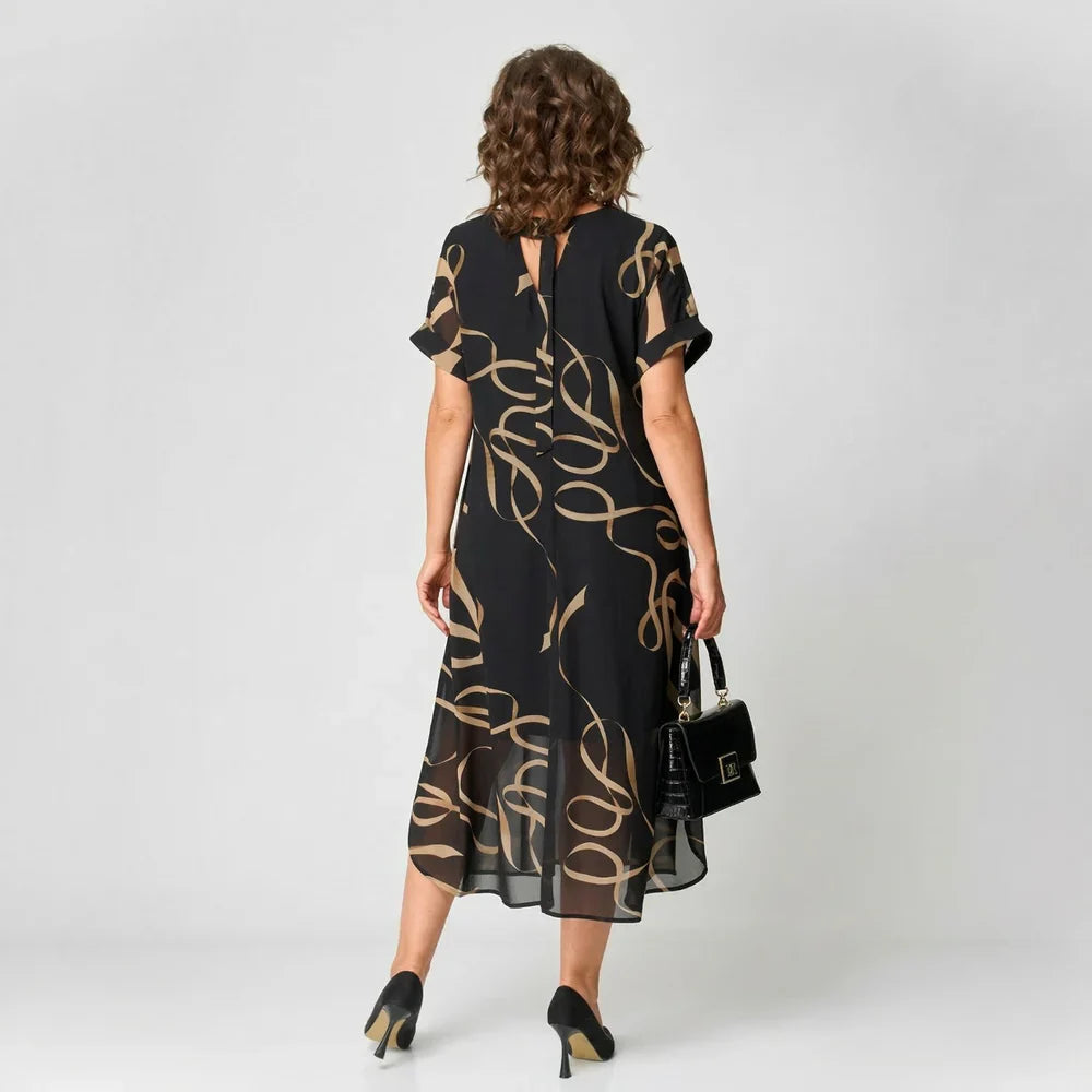 Patricia - Vestido con volante y estampado dorado