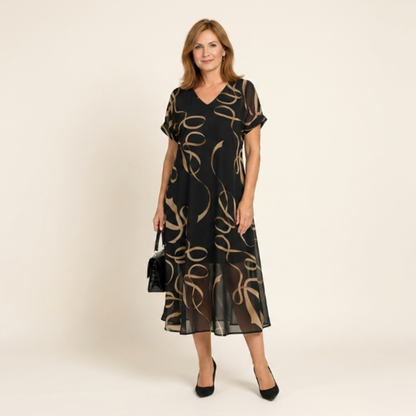 Patricia - Vestido con volante y estampado dorado